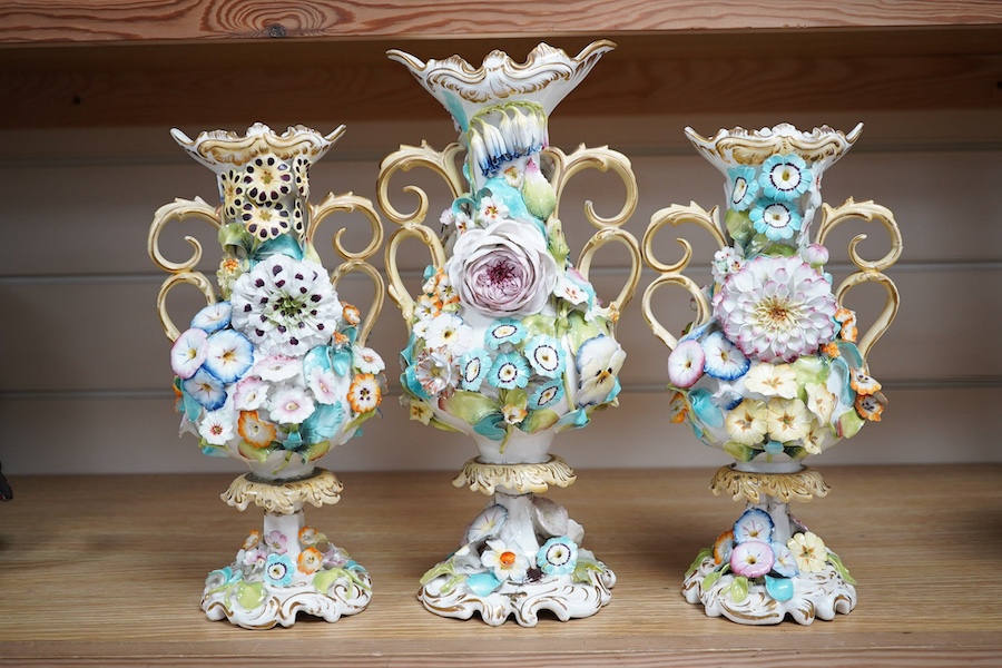 A Coalport garniture vase set with applied flowers, tallest 31cm. Condition - restored